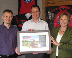 Bill Nagelkerke, Children's and Young Adult Services Coordinator, and Pat Street, Programmes and Learning Manager presented Hamish with a framed 'thank you'