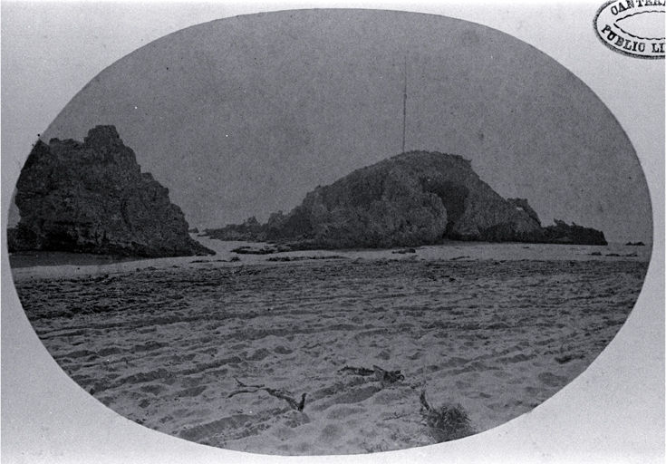 Cave Rock with the mast and yard-arm used to signal the state of the Sumner Bar tides 