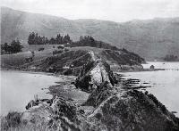 A historic spot in Akaroa Harbour at the neck of the Onawe Peninsula : remains of the Takapuneke Pa can still be seen. [1922]