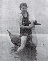 The Goose Girl : a young bather tests out her new inflatable at a local Christchurch beach. [1929]