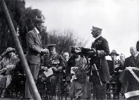 Mr Gummer, architect, presenting Lord Jellicoe with trowel and mallet, foundation stone ceremony, Bridge of Remembrance