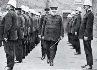 Superintendent W H Mackinnon makes his last inspection of his men, as the Christchurch police force bid him farewell [1926]