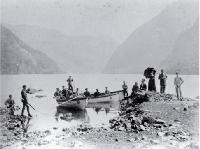 Tourists in small boats hunting in Wet Jacket Arm, Dusky Sound, Fiordland, ca Jan 1884
