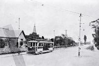 An electric tram at the intersection of Harewood Road and Main North Road, Christchurch, 1906