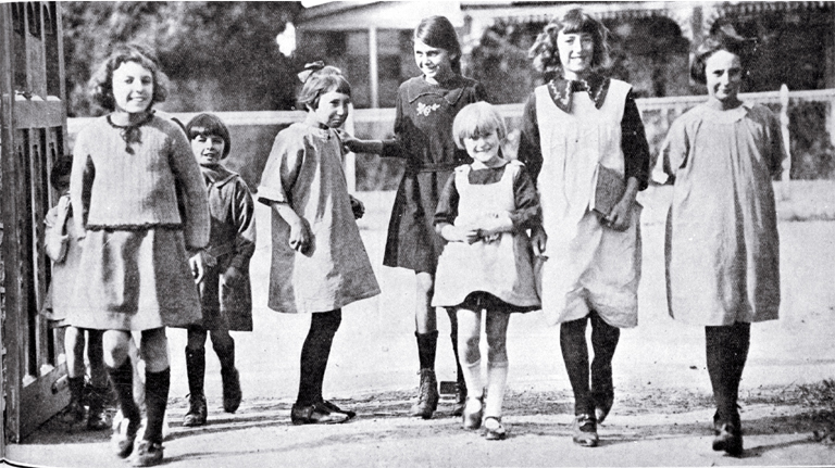 Are we downhearted? : girls merrily on their way to Phillipstown School on the day Christchurch schools reopened after five months due to the removal of restrictions on the assembly of children after the end of the infantile paralysis epidemic.