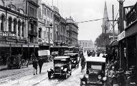 Cars, cyclists and pedestrians in Colombo Street, Christchurch, ca 1930
