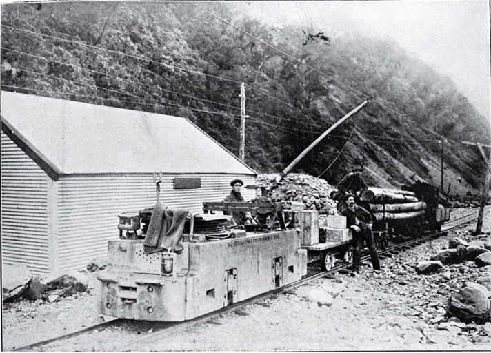 Electric locomotion with a train load of explosives and timber to be used in the construction of the Arthur's Pass Tunnel 