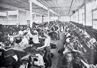 The interior of a clothing factory
[1909]