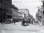 A horse and dray among the cars in Manchester Street, looking south towards the Clock Tower. 