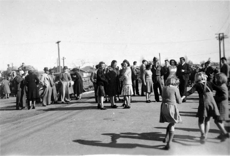 Some of the crowd who celebrated VJ Day (14 August 1945) shown at the corner of Strowan and Normans Roads, Bryndwr