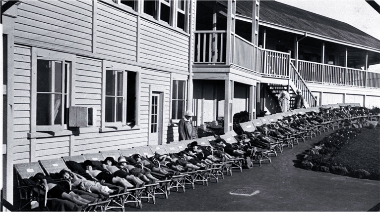 Children lying on stretchers outside the Fresh Air Home, Cashmere Sanatorium, Christchurch 
