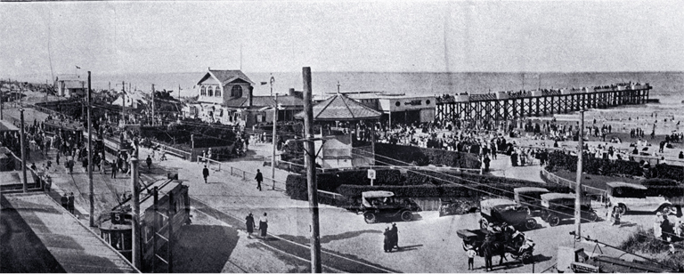 General view of pier and enclosures : showing terminus of two trams and pier front.