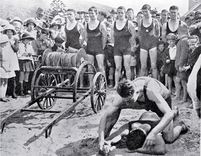 A demonstration of artificial respiration at the opening of the lifesaving season : team lined up behind the reel.