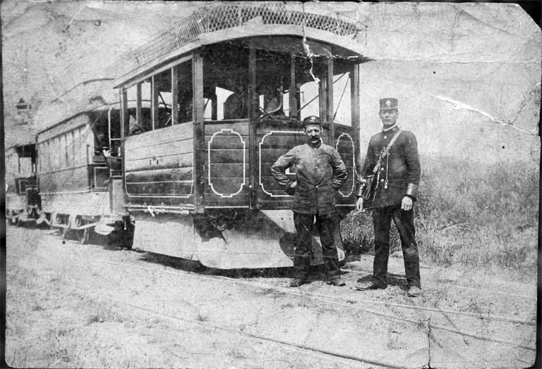 A Kitson steam tram hauling two saloon double-deckers