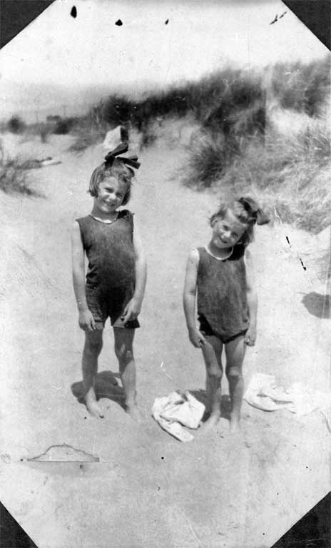 Children at the beach, wearing woollen togs