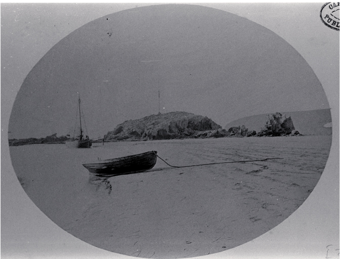 Small boat and dinghy beached near Cave Rock, Sumner, Christchurch 