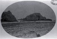 Cave Rock with the mast and yard-arm used to signal the state of the Sumner Bar tides