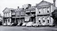 Cars parked outside the Grenadier Hotel in Oxford Terrace 