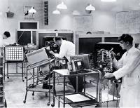 Technicians at work in the service department of the television section at Philips Electrical Industries Ltd. 