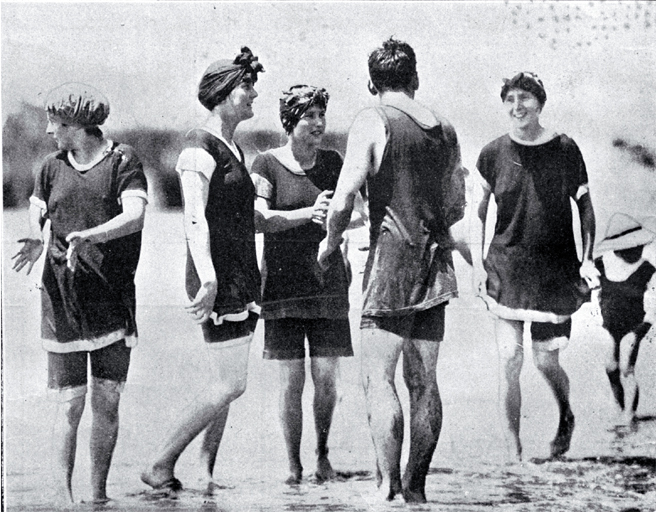 A group of young bathers in bathing costumes in the surf at Sumner ...