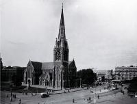 Pedestrians & trams in Cathedral Square, looking toward the Bank of New Zealand corner & the United Service Hotel, Christchurch 