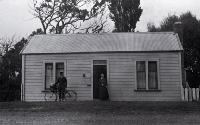 Amelia Frances Rogers with a postman, Mr Heffenden, outside the Burwood Post Office. Between 1924 and 1928