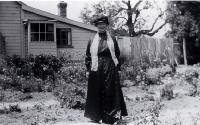 Amelia Frances Rogers (1849-1928) beside her riverside home at 348 New Brighton Road