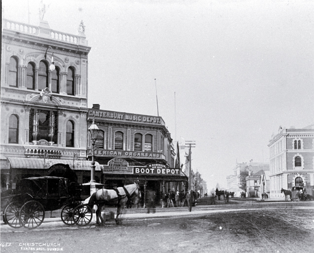A hackney at the intersection of Cashel & High Streets : with Milner & Thompson's music store on the right & Inglis' building on the left.