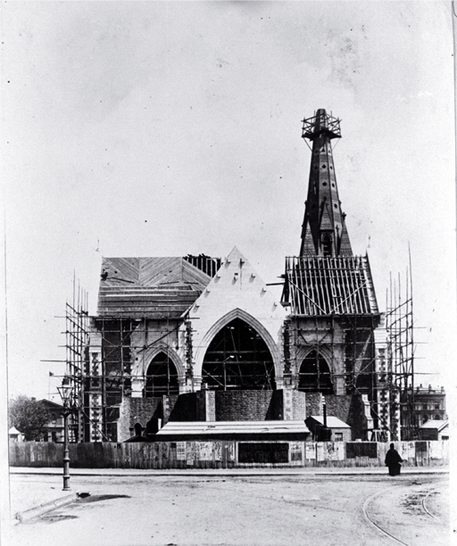 The spire, north transept & choir of the Cathedral under construction, looking at the east arch from Worcester Street, Christchurch 