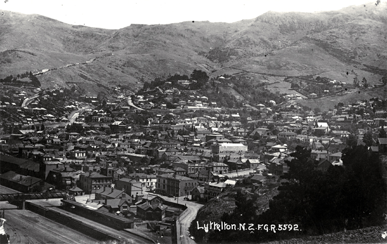 Railway lines at Lyttelton and panoramic view of houses and hills 