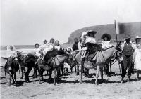 Children taking donkey rides on Sumner beach, Christchurch 