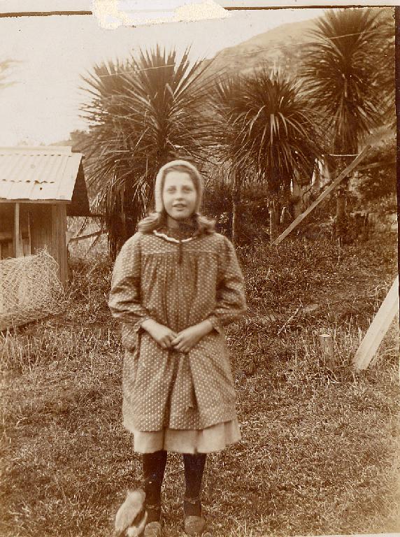 Dorothy Gimblett - August 1907 - at Mcdowell's (10 1/2) Bridle Path Road, Heathcote - note pet magpie.