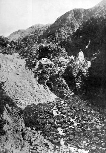 On the route of the Midland Railway: surveyors’ huts at the top of the Otira Gorge, West Coast Road.