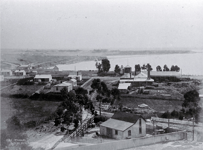 View from Maori Hill across to Dashing Rocks (the area of the Freezing Works), Timaru : to the right is a sawmill.