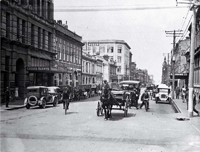 A horse and dray among the cars in Manchester Street, looking south towards the Clock Tower 