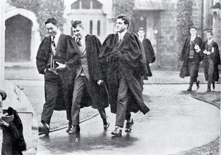 Undergraduate students in gowns in the quadrangle on their way to lecture rooms, Canterbury College 