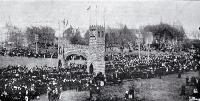 A procession turns through the Triumphal Arch to Market Square at Queen Victoria's Jubilee celebrations 