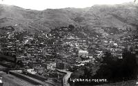 Railway lines at Lyttelton and panoramic view of houses and hills