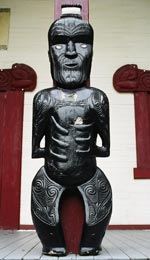 Carving of the ancestor Paikea in the centre of the porch of Te Whatu Manawa Māoritanga O Rēhua
