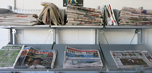Photo of newspapers at Central Library Manchester