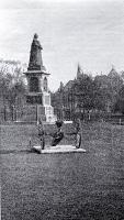 A pom pom gun captured from the Boers in front of the statue of Queen Victoria