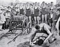 A demonstration of artificial respiration at the opening of the lifesaving season : team lined up behind the reel.