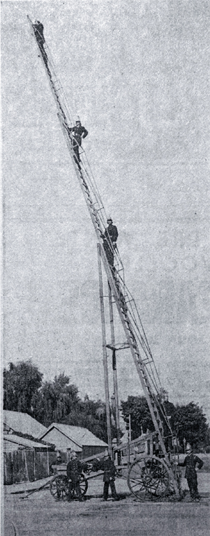 A team of Christchurch's volunteer firemen with their big extension ladder 