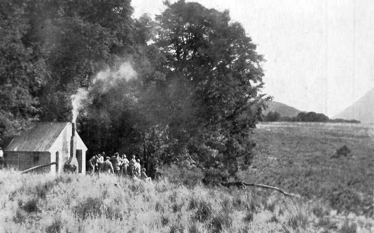 A half-way house. The party at the shepherd’s whare, about midway between the Bealey and the Crow rivers.