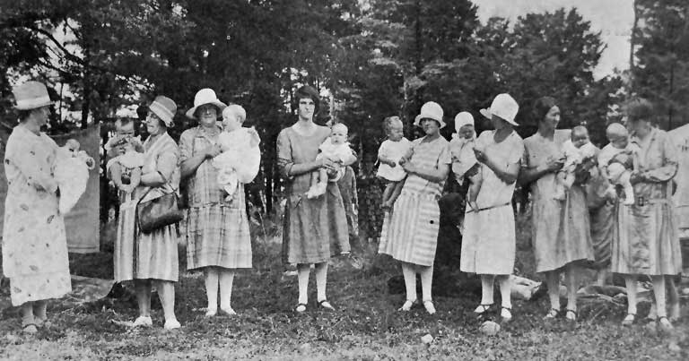 Proud mothers and their chubby children. Prize- winners in the baby competition.