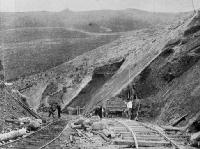 Widening a cutting. The earth and shingle taken from these cuttings are used for filling in the gullies.