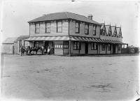 Unidentified hotel, probably in Canterbury : one of the Moderate Brothers on the verandah to the right of the horse.