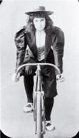 Lady racing cyclist, Lancaster Park, Christchurch 