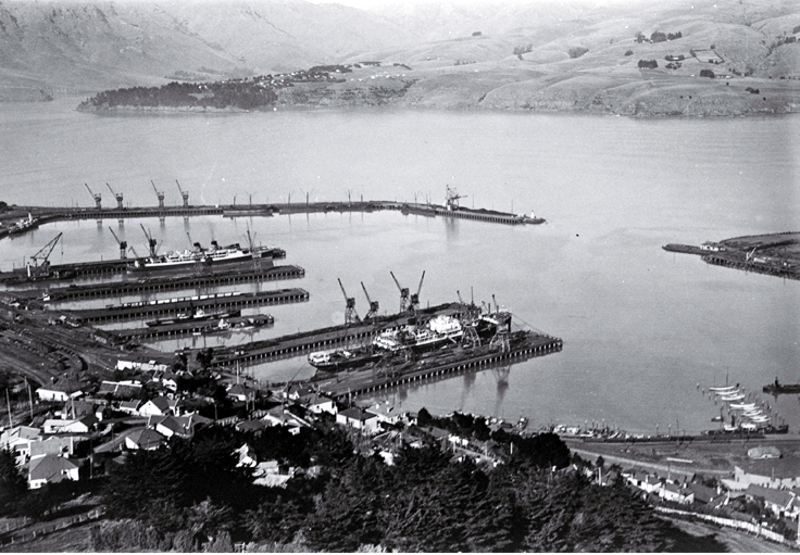 Ships berthed at Lyttelton Harbour : Diamond Harbour can be seen in the distance.