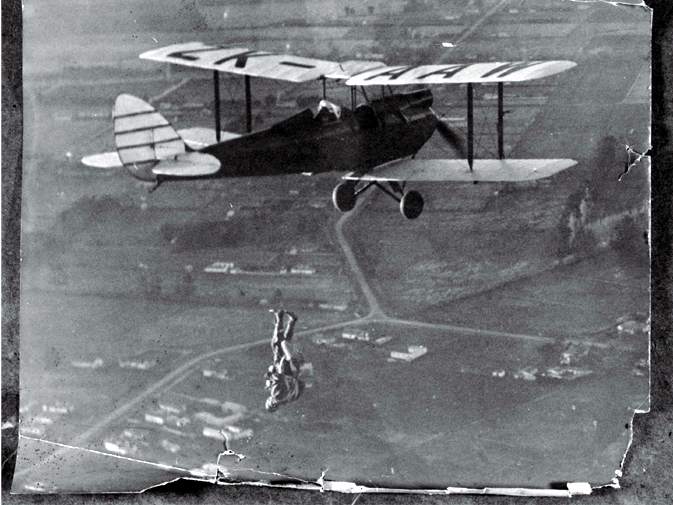 Parachutist free-falling from a Tiger Moth over Christchurch 